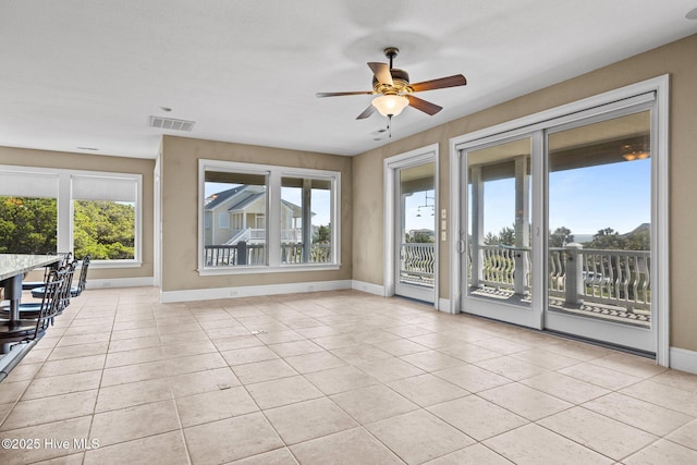10108 Sea Breeze Dr, Emerald Isle, NC 28594 - unfurnished living room featuring ceiling fan and light tile patterned floors