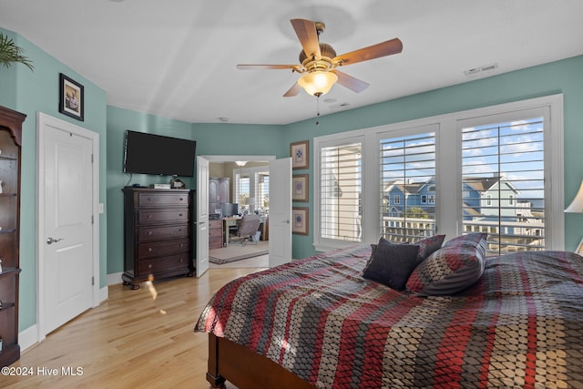 bedroom with light wood-type flooring and ceiling fan