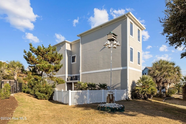 view of property exterior featuring a lawn