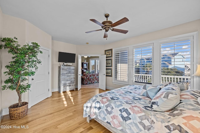 bedroom with hardwood / wood-style floors and ceiling fan