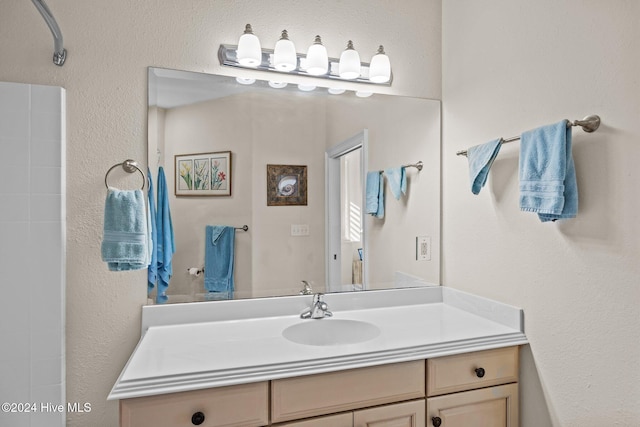 10108 Sea Breeze Dr, Emerald Isle, NC 28594 - bathroom with vanity, a shower, and a textured wall