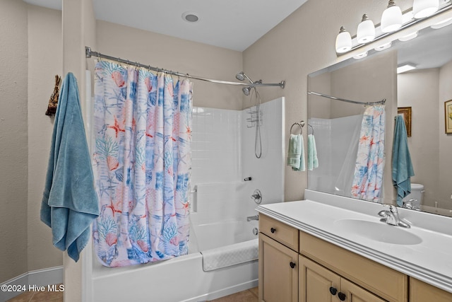 bathroom featuring tile patterned flooring, vanity, and shower / tub combo with curtain