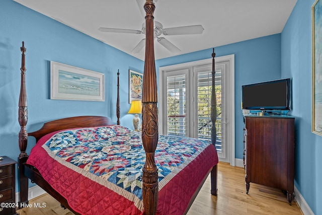 bedroom with access to outside, light hardwood / wood-style flooring, and ceiling fan