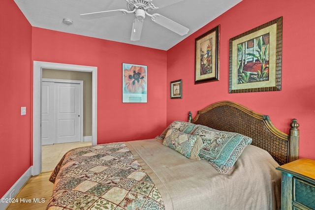 bedroom with hardwood / wood-style floors and ceiling fan