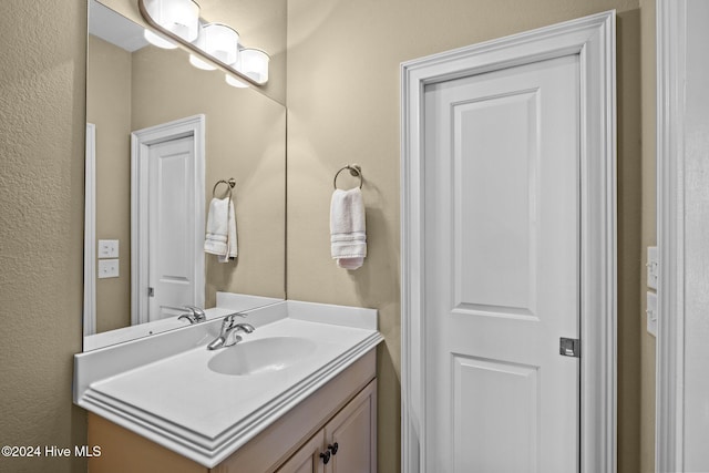 10108 Sea Breeze Dr, Emerald Isle, NC 28594 - bathroom featuring vanity and a textured wall
