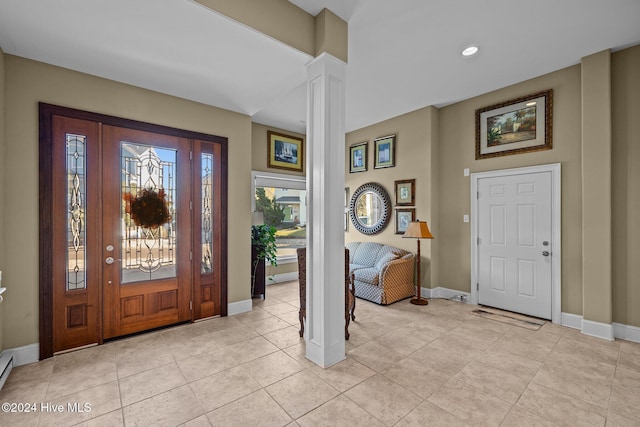 10108 Sea Breeze Dr, Emerald Isle, NC 28594 - foyer featuring decorative columns, light tile patterned floors, and recessed lighting