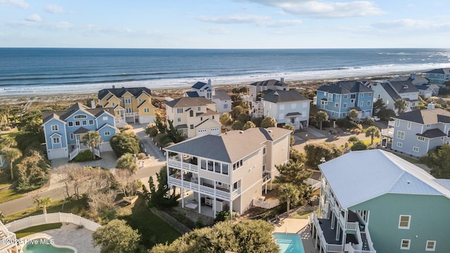 aerial view featuring a view of the beach and a water view