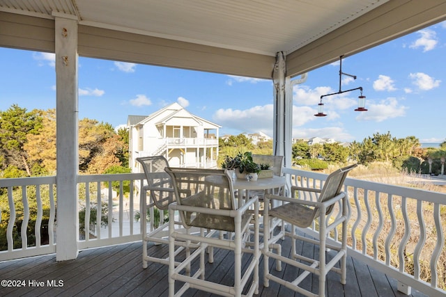 10108 Sea Breeze Dr, Emerald Isle, NC 28594 - wooden terrace featuring outdoor dining space