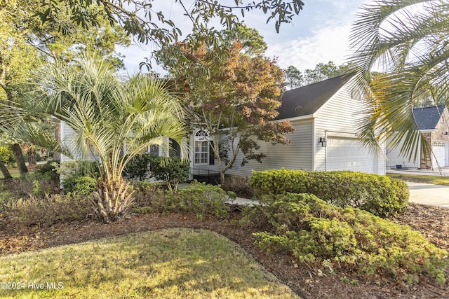 864 Sandpiper Bay Dr SW, Sunset Beach, NC 28468 - view of property hidden behind natural elements with concrete driveway
