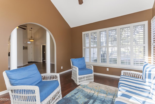 864 Sandpiper Bay Dr SW, Sunset Beach, NC 28468 - living area featuring arched walkways, a ceiling fan, healthy amount of natural light, wood finished floors, and high vaulted ceiling
