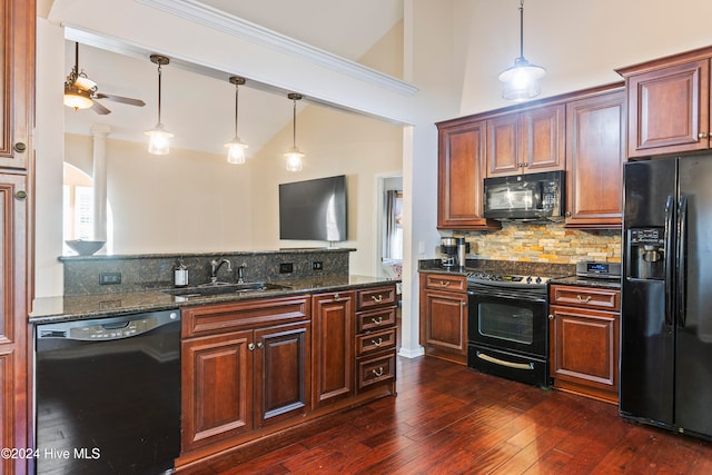 kitchen featuring decorative backsplash, dark stone counters, dark wood-type flooring, black appliances, and high vaulted ceiling