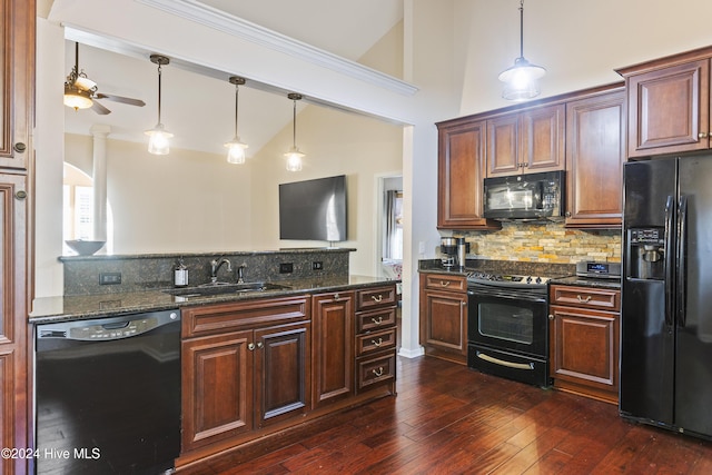 864 Sandpiper Bay Dr SW, Sunset Beach, NC 28468 - kitchen with black appliances, vaulted ceiling, decorative backsplash, dark wood finished floors, and ceiling fan