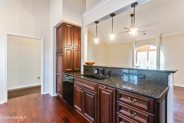 kitchen featuring dark wood-type flooring, sink, ceiling fan, dark stone countertops, and black dishwasher