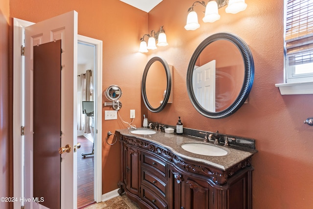 bathroom featuring wood-type flooring and vanity