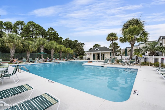 864 Sandpiper Bay Dr SW, Sunset Beach, NC 28468 - community pool with a patio