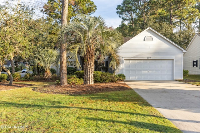 view of front of home with a front lawn and a garage