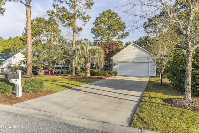 864 Sandpiper Bay Dr SW, Sunset Beach, NC 28468 - view of front facade with a garage, a front lawn, and concrete driveway