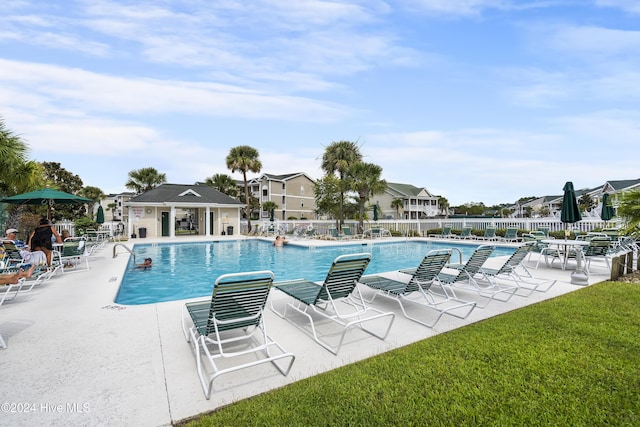 864 Sandpiper Bay Dr SW, Sunset Beach, NC 28468 - community pool with a patio