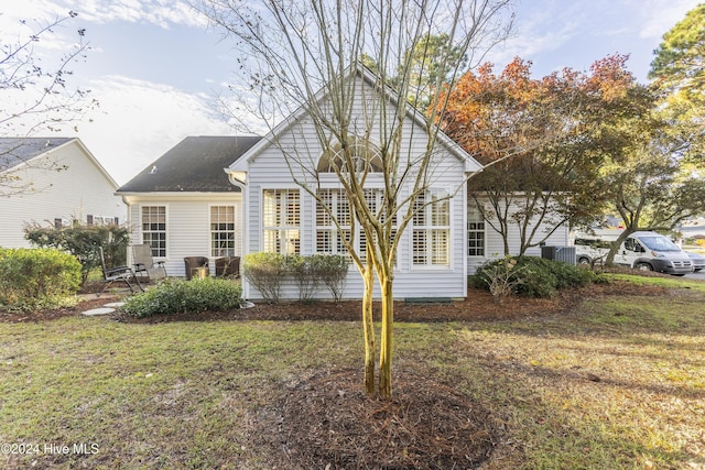 864 Sandpiper Bay Dr SW, Sunset Beach, NC 28468 - rear view of property with a yard
