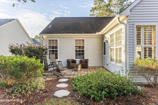 rear view of house featuring a patio