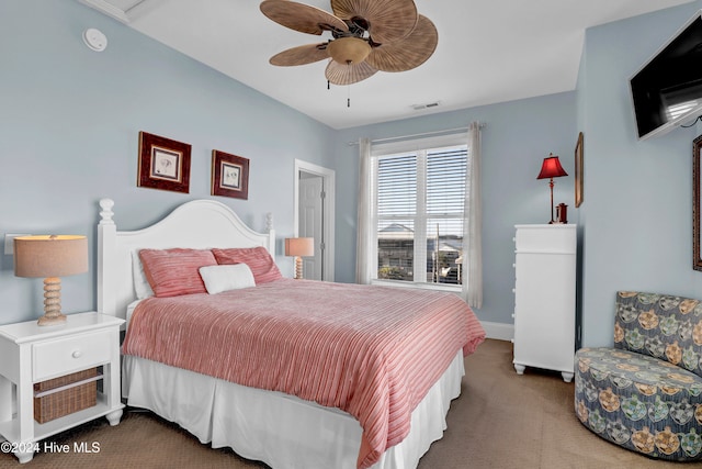 bedroom with ceiling fan and carpet