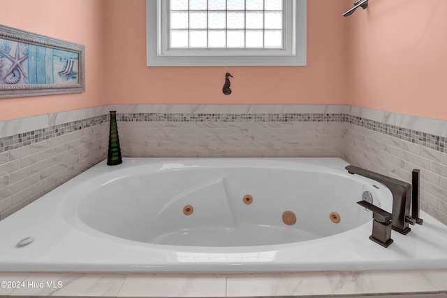 bathroom with a tub to relax in