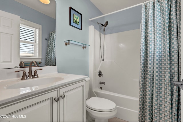 full bathroom featuring shower / tub combo, vanity, and toilet