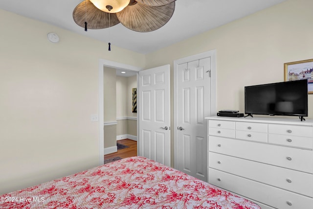 bedroom featuring wood-type flooring and ceiling fan