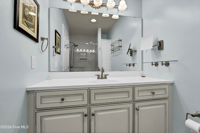 bathroom featuring vanity and a shower