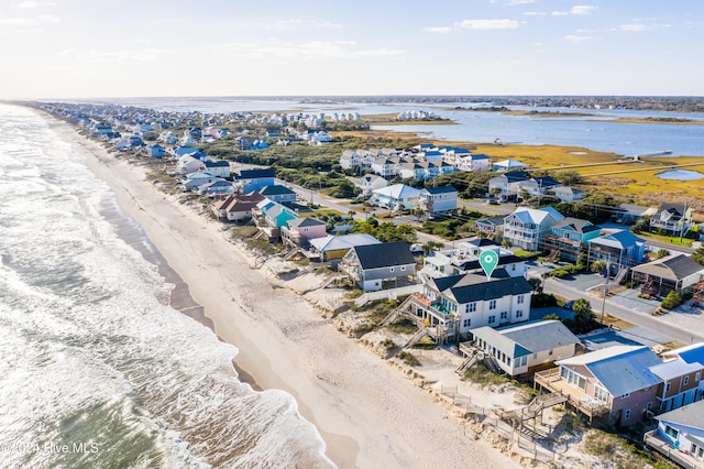 aerial view featuring a water view and a beach view