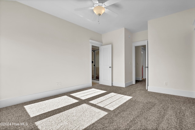 unfurnished bedroom featuring ceiling fan and carpet