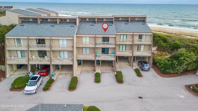 aerial view featuring a water view and a view of the beach