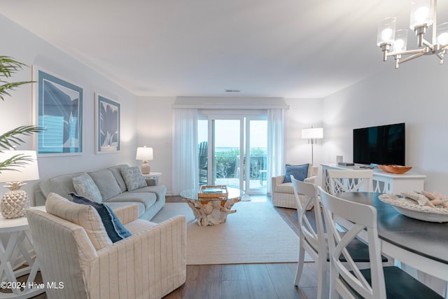 living room featuring hardwood / wood-style floors and a notable chandelier