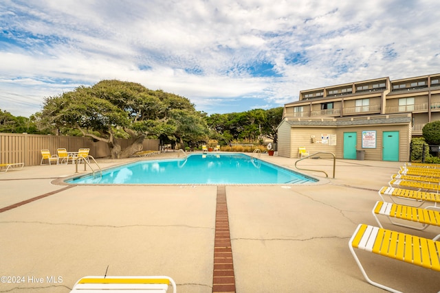 view of swimming pool featuring a patio area