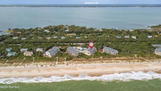 birds eye view of property featuring a view of the beach and a water view