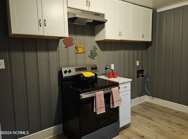 kitchen featuring electric range, white cabinets, and light wood-type flooring