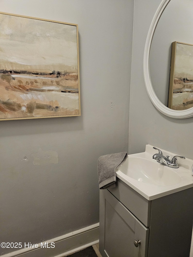 bathroom featuring vanity and baseboards