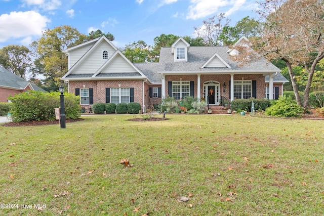 view of front of property with a front yard and a porch