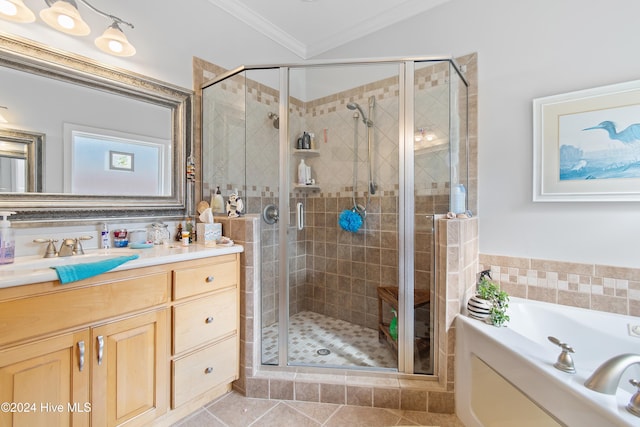 bathroom with tile patterned floors, vanity, ornamental molding, and plus walk in shower