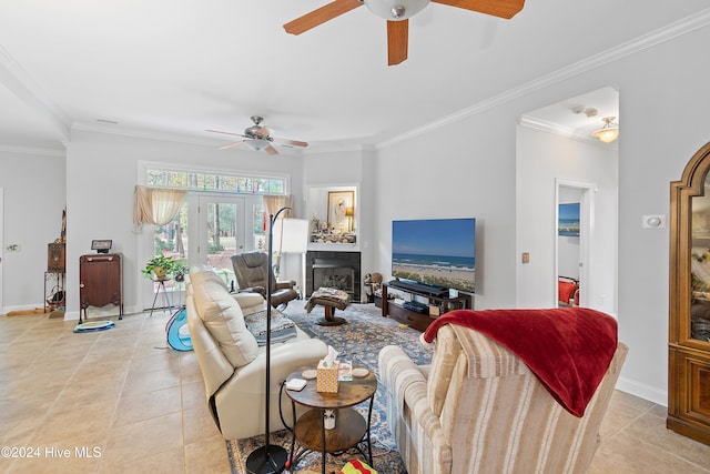 tiled living room featuring french doors, ceiling fan, and ornamental molding