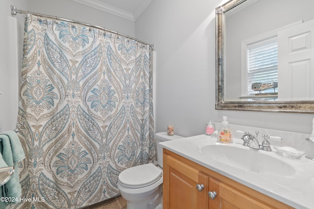 bathroom featuring vanity, toilet, curtained shower, and crown molding