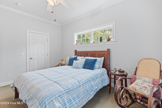 bedroom with carpet flooring, ceiling fan, and crown molding