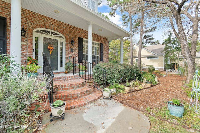 doorway to property featuring a porch