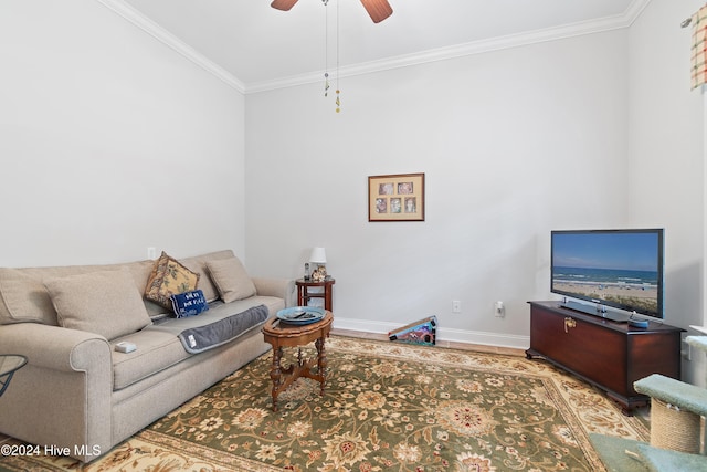 living room featuring hardwood / wood-style floors, ceiling fan, and ornamental molding