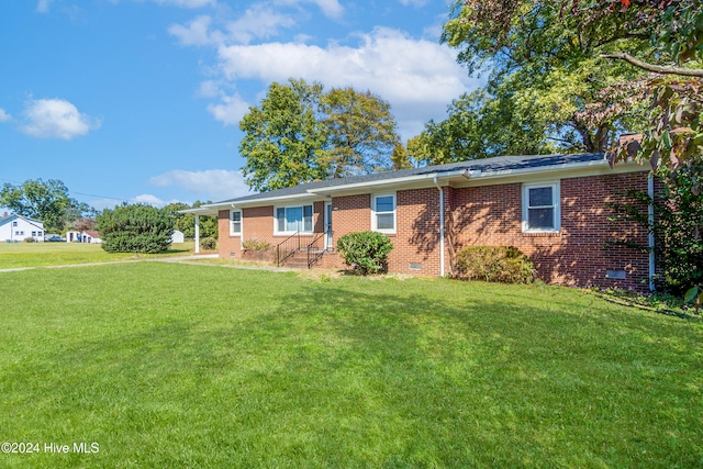 ranch-style home with a front yard