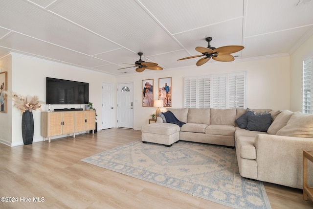 living room featuring ornamental molding, hardwood / wood-style floors, and ceiling fan