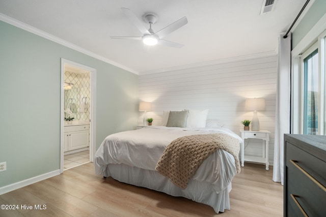 bedroom featuring ornamental molding, ensuite bathroom, ceiling fan, and light hardwood / wood-style floors