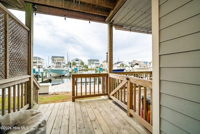 wooden terrace with a water view