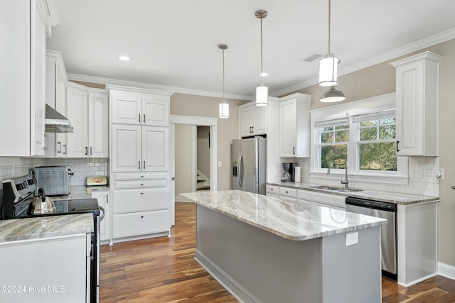 kitchen featuring white cabinetry, a kitchen island, stainless steel appliances, and dark hardwood / wood-style floors