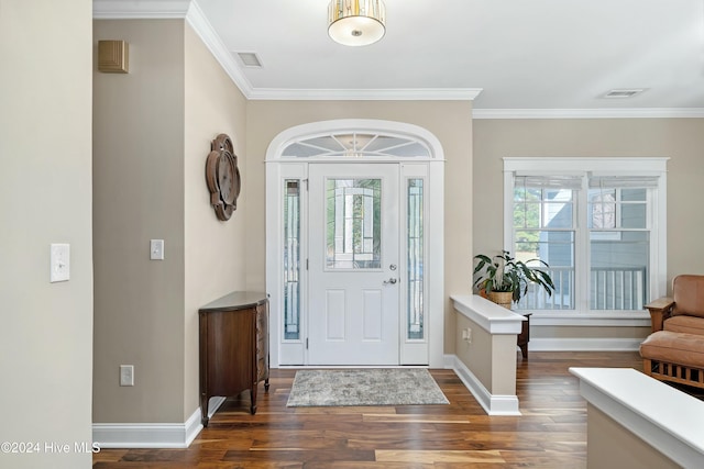 entrance foyer featuring dark hardwood / wood-style flooring and ornamental molding